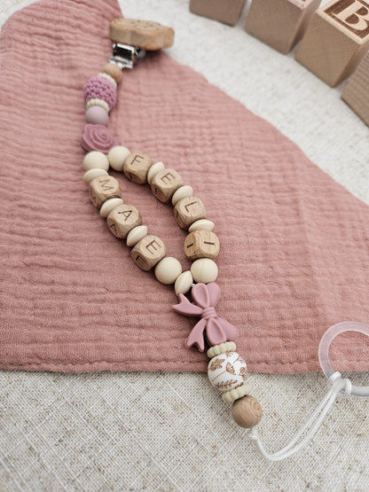 Personalisierte Schnullerkette mit Namen – Baby Mädchen rosa - Schleife - Holzbuchstaben