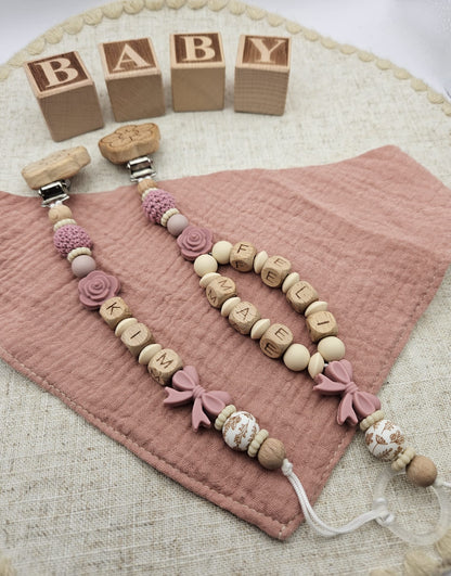 Personalisierte Schnullerkette mit Namen – Baby Mädchen rosa - Schleife - Holzbuchstaben